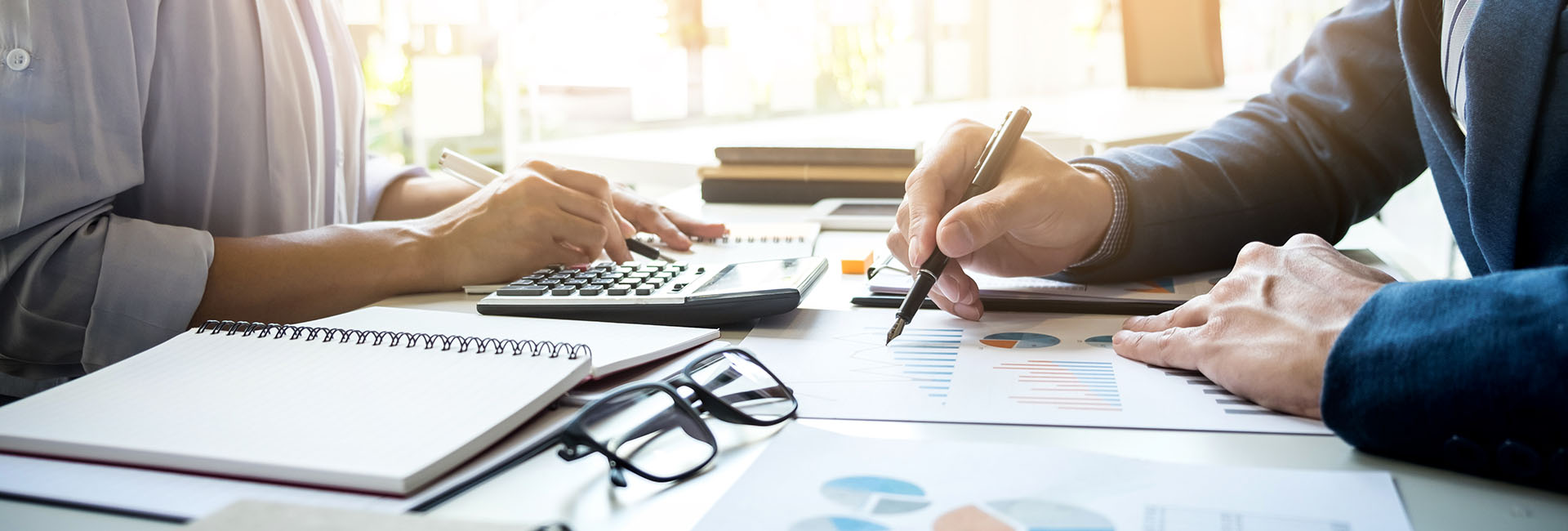 business man financial inspector and secretary making report, calculating or checking balance. Internal Revenue Service inspector checking document. Audit concept